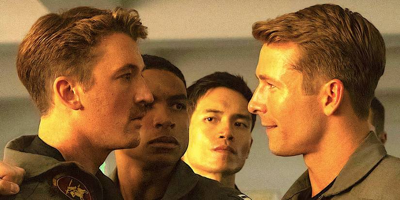 Miles Teller's Rooster and Glen Powell's Hangman face off with Manny Jacinto's Fritz in the background from Top Gun Maverick