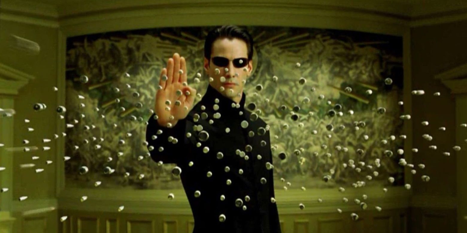 Neo (Keanu Reeves) para balas em Matrix Reloaded