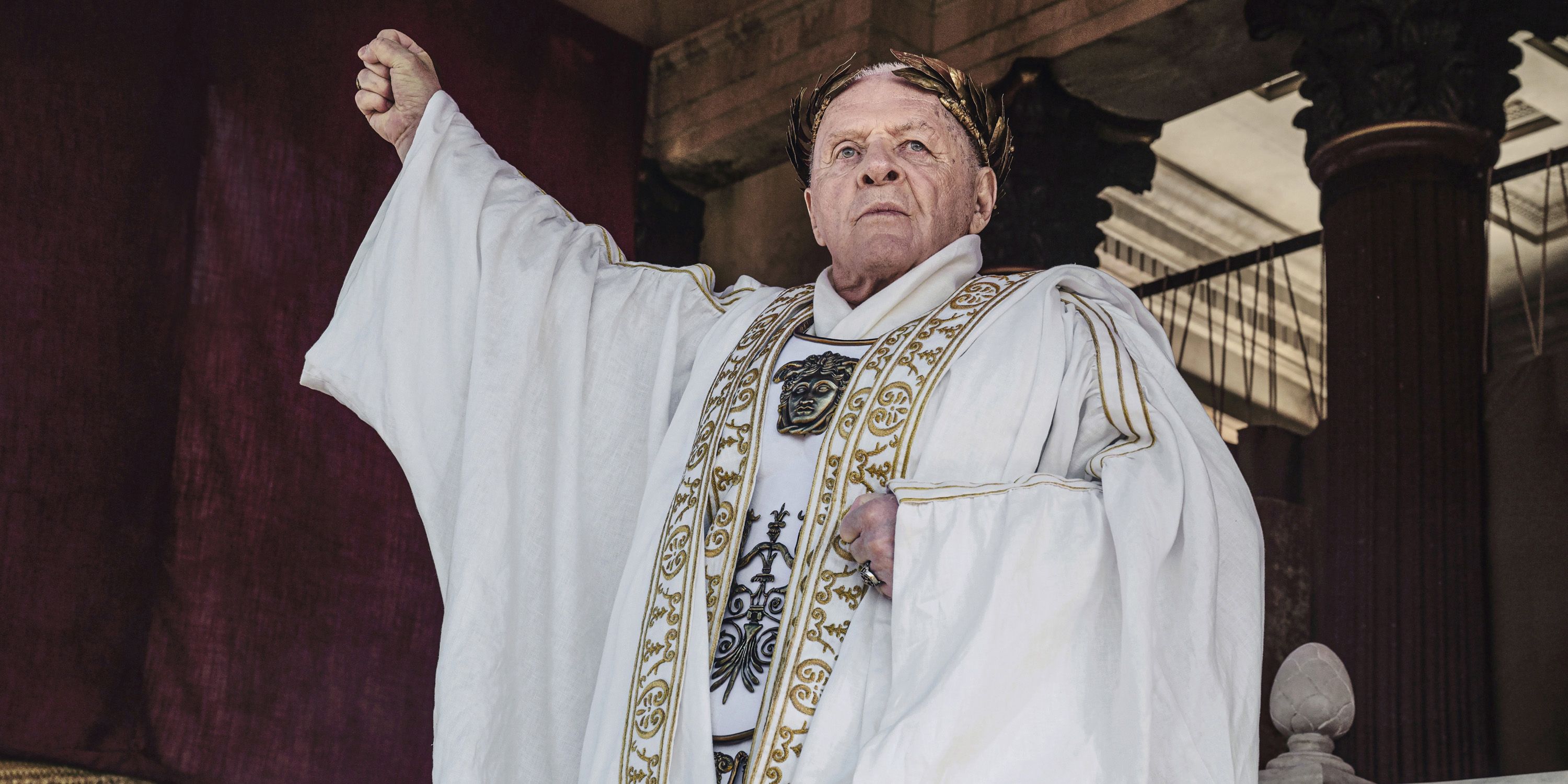 Anthony Hopkins as Vespasian with hand raised in Those About to Die