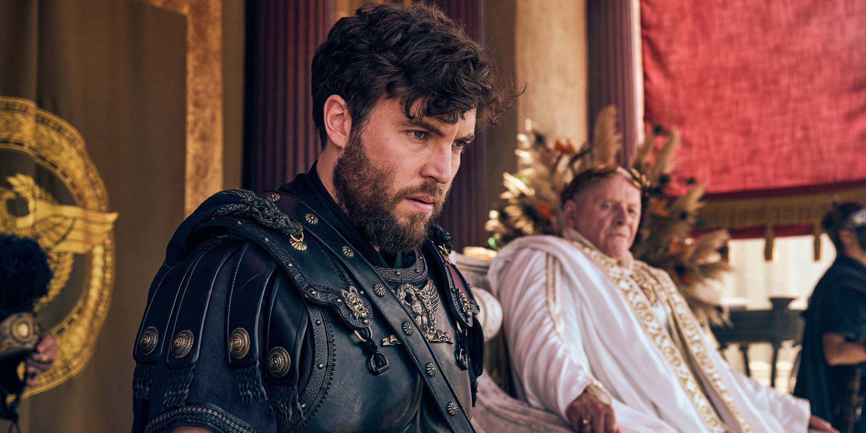 Tom Hughes as Titus and Anthony Hopkins as Emperor Vespasian spectating in Those About to Die.