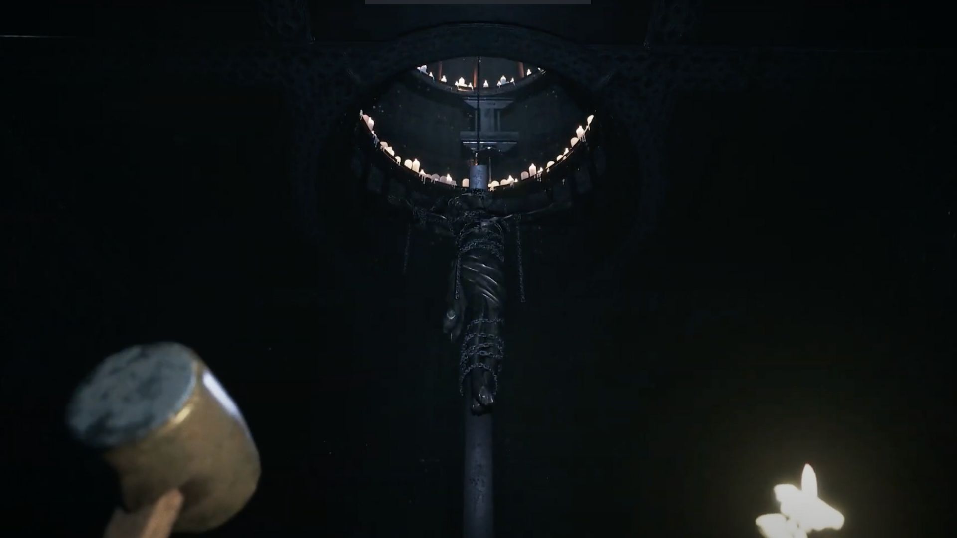 Player looking up at candles and a figure hanging in Visage