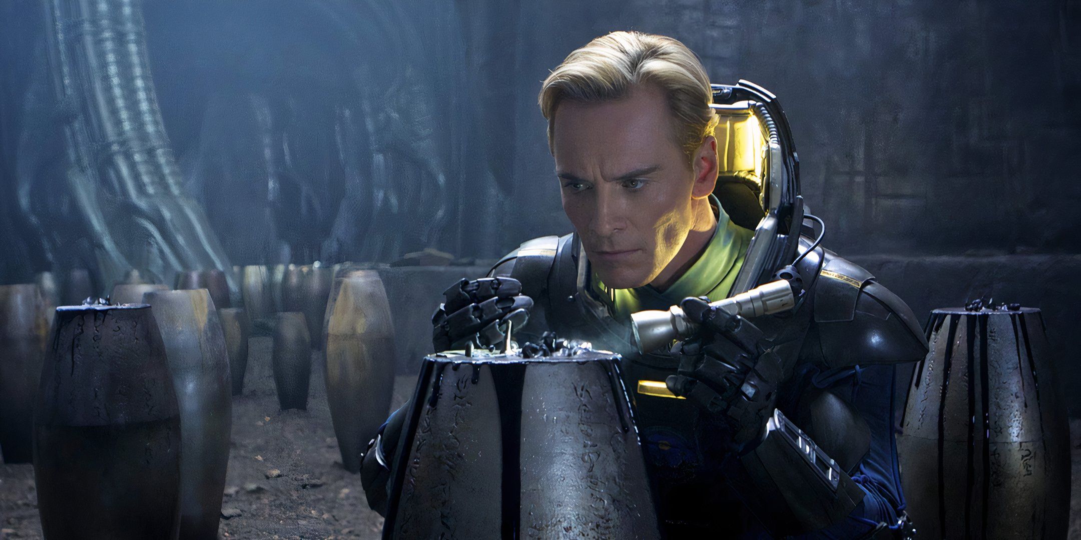 The android David (Michael Fassbender) examines a black mutagen in Prometheus.