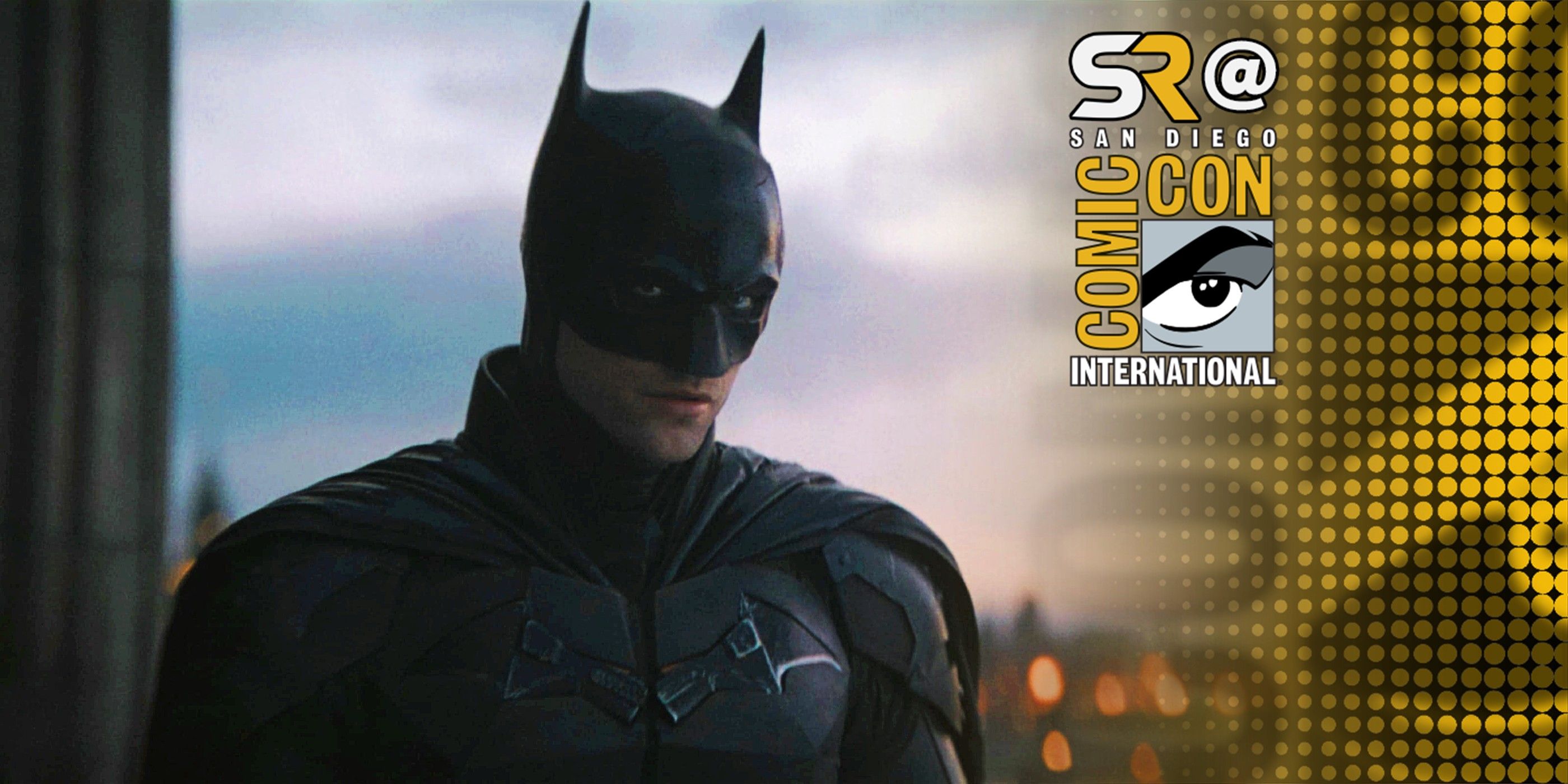 Robert Pattinson As Batman In Full Costume At Dawn With Gotham Behind Him In The Batman With SDCC Overlay