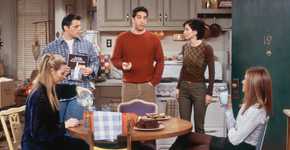 Ross talking in the apartment while Joey, Monica, and Rachel listen and Phoebe pours herself some milk in Friends