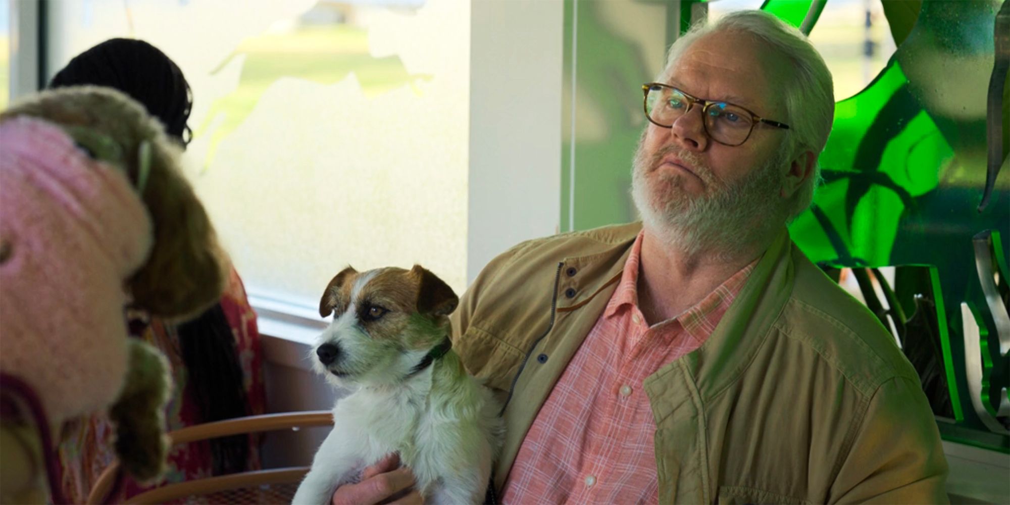 Roy holding a dog in a cafe NCIS Sydney