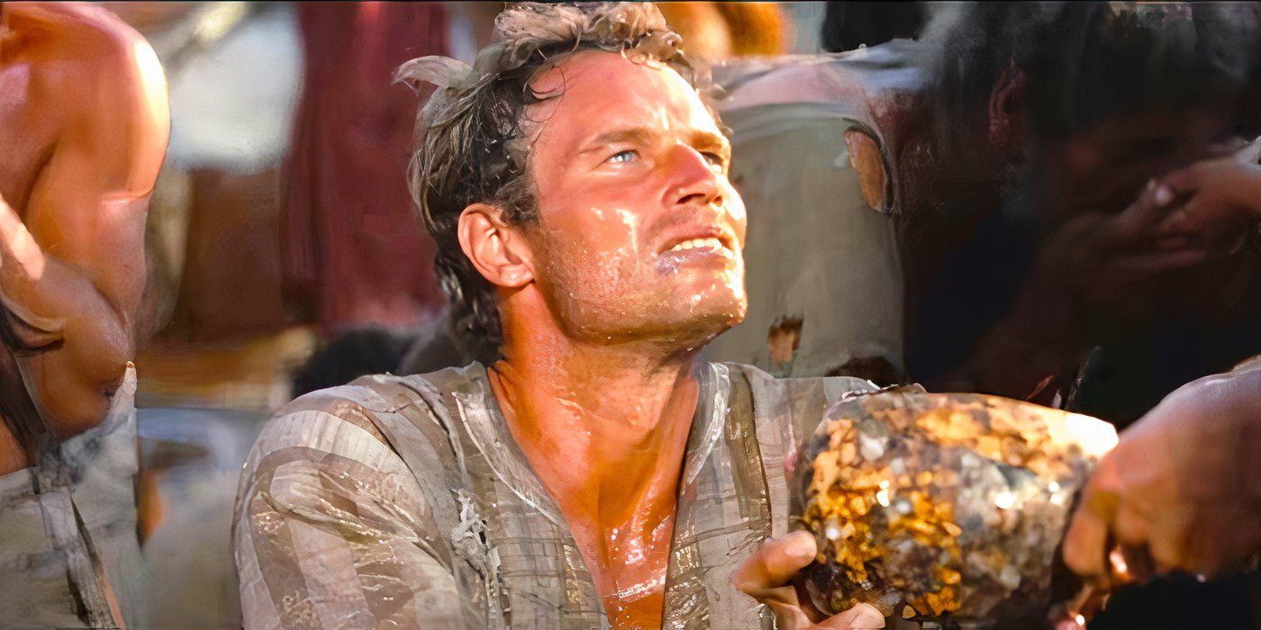 Charlton Heston sebagai Yudas Ben-Hur mendapatkan air dari Yesus di Ben-Hur (1959)