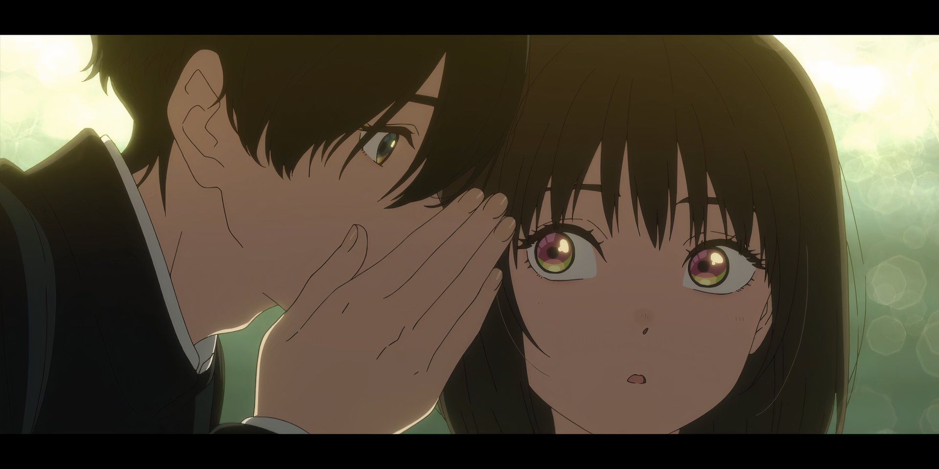 A close up shot of Kobato covering his mouth with his hand while whispering into Osanai&rsquo;s ear