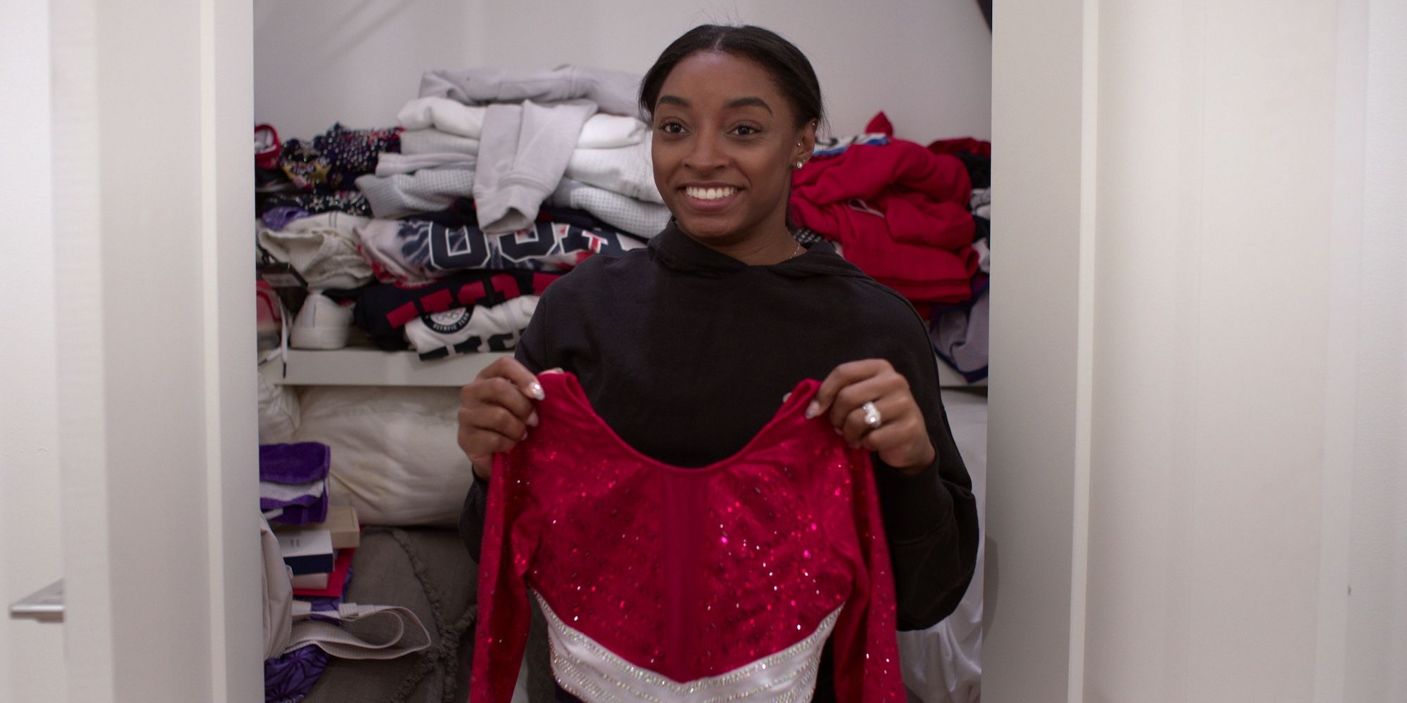 Simone Biles holding leotard in Simone Biles rising