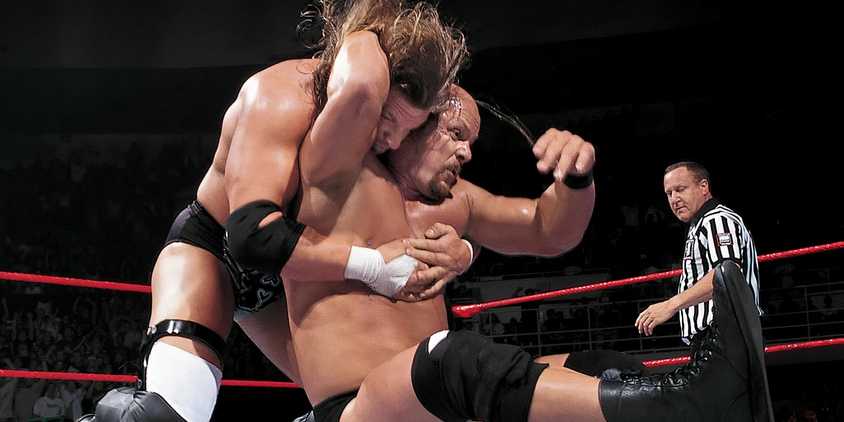 Stone Cold Steve Austin doing the Stunner on Triple H