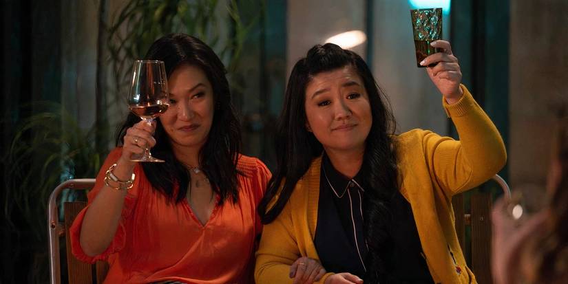 Sumi (Kara Wang) and Alice (Sherry Cola) raising a glass in a toast in the Good Trouble series finale.
