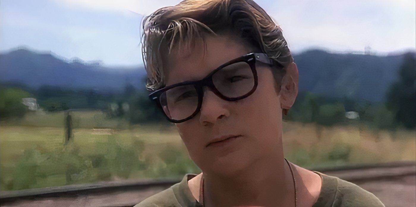 Teddy (Corey Feldman) standing by the railroad tracks in Stand By Me