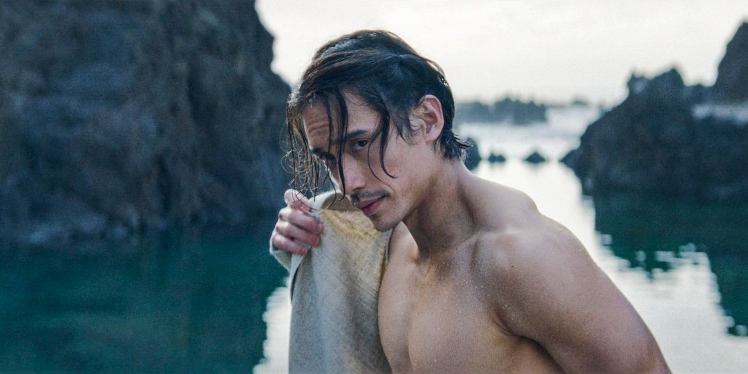 Qimir (Manny Jacinto) putting on his clothes after getting out of the sea in The Acolyte season 1 episode 6