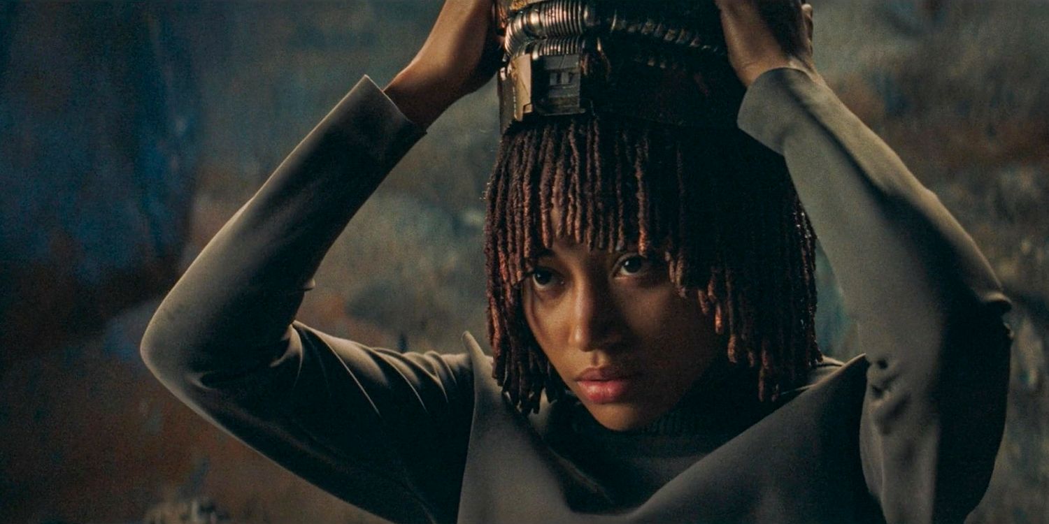 Osha (Amandla Stenberg) putting on Qimir's helmet in The Acolyte season 1 episode 6