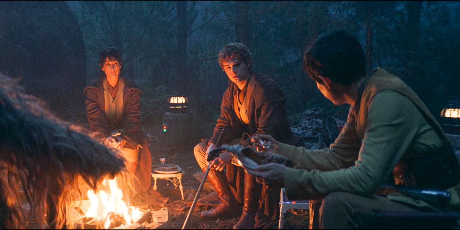 Indara, Koril, and Sol gathered around a campfire at their camp in Brendok in The Acolyte season 1 episode 7