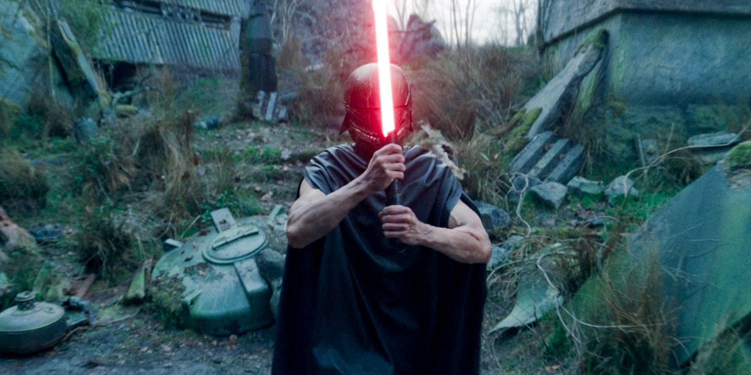 Qimir wearing a helmet, wielding his lightsaber in front of him in The Acolyte season 1 episode 8