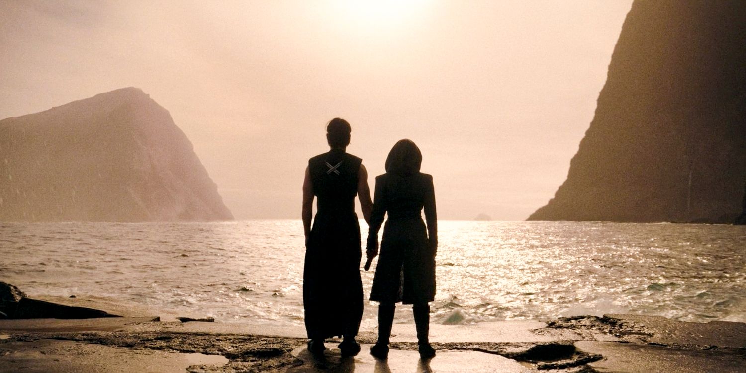 Qimir and Osha holding hands, looking towards the horizon on the unknown planet in The Acolyte season 1 episode 8