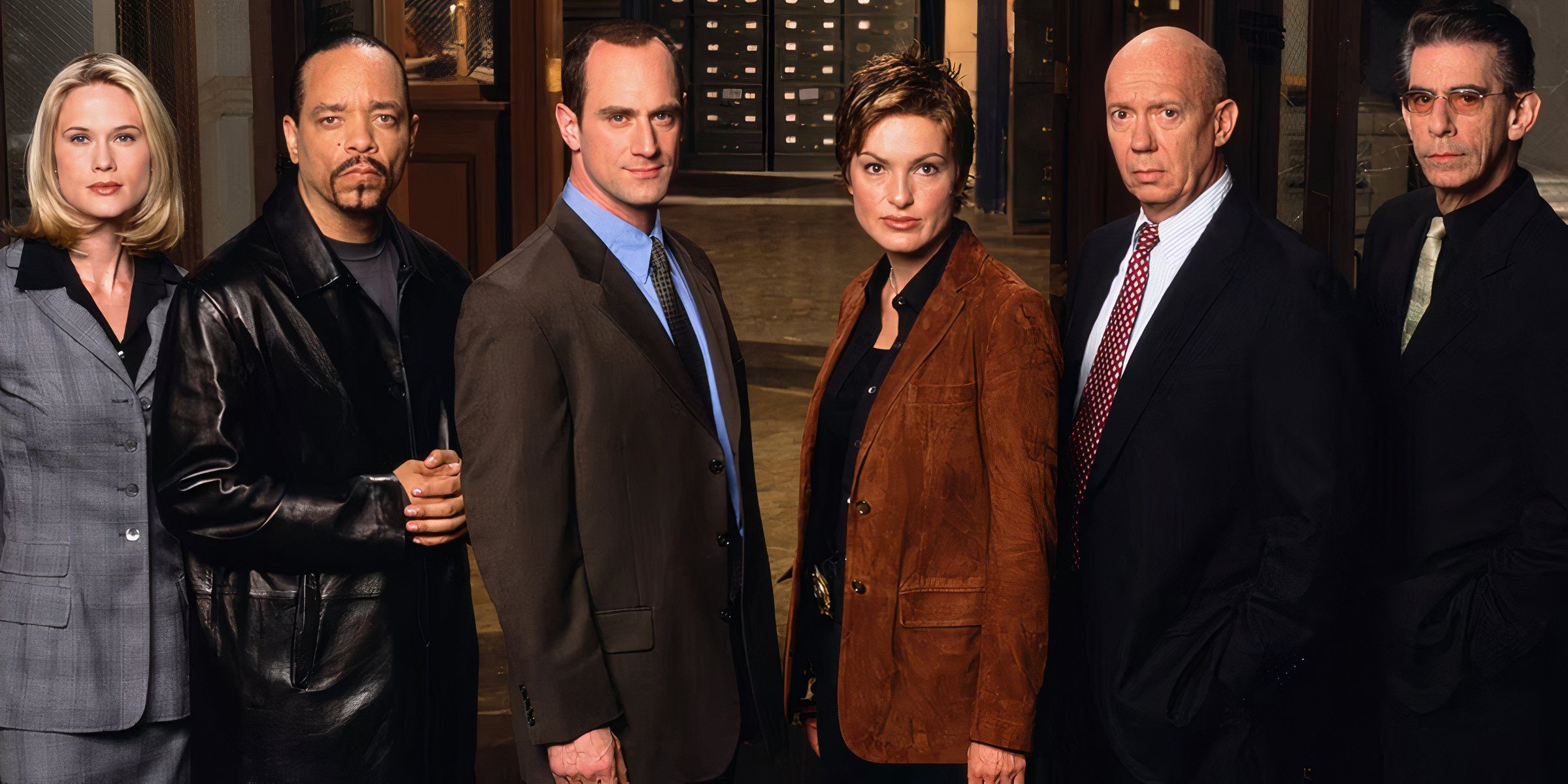 The cast of Law and Order SVU season 4 stares straight at the camera