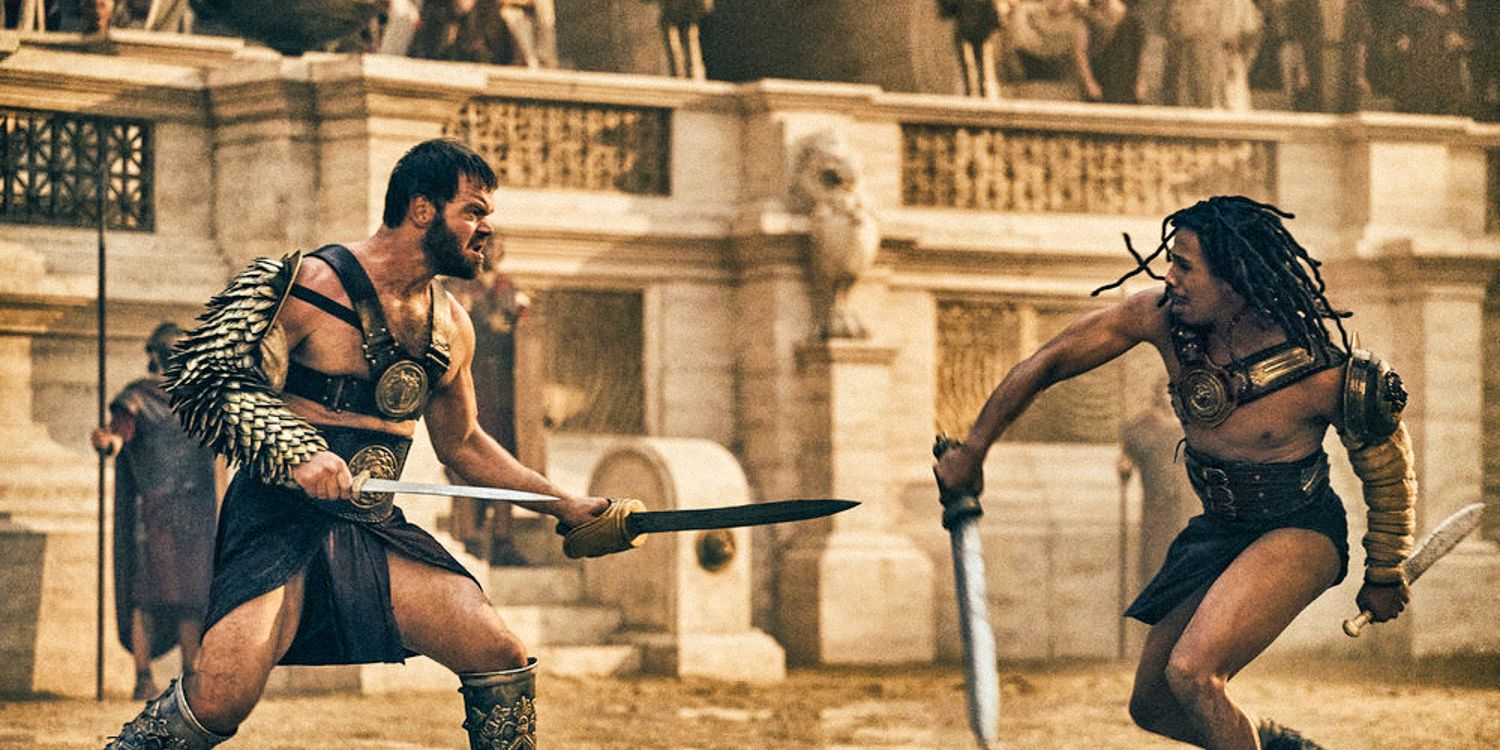 Dois gladiadores lutando com espadas na arena em Those About to Die