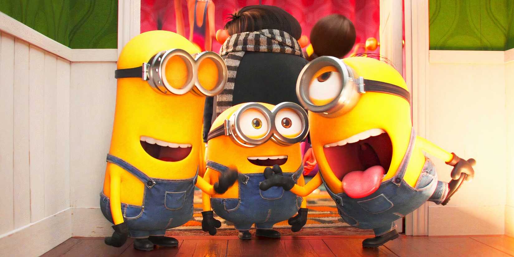 Three minions smiling and making faces in Minions The Rise of Gru