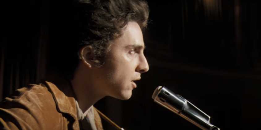 Timothee Chalamet as Bob Dylan singing in A Complete Unknown