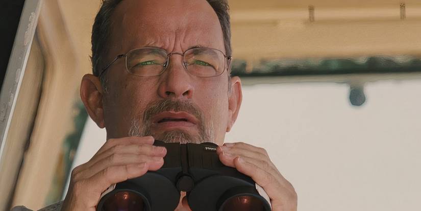 Tom Hanks holding binoculars in Captain Phillips