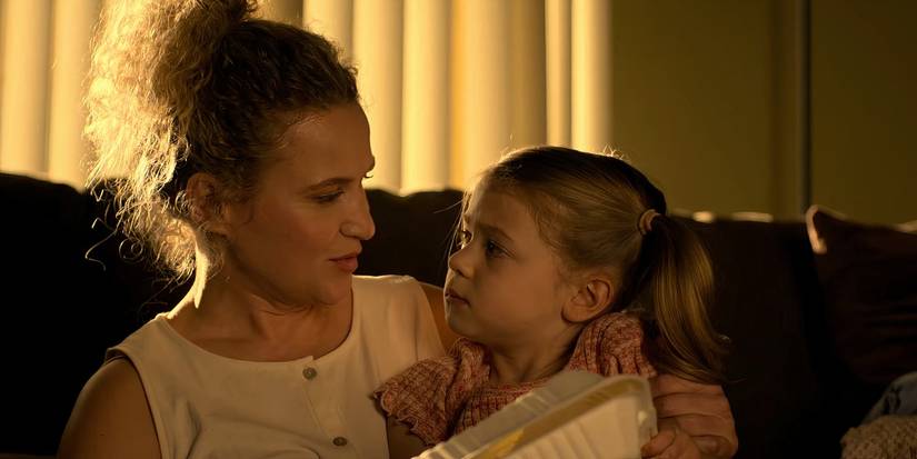 Tory's Mom holding her child lovingly in Cobra Kai season 6