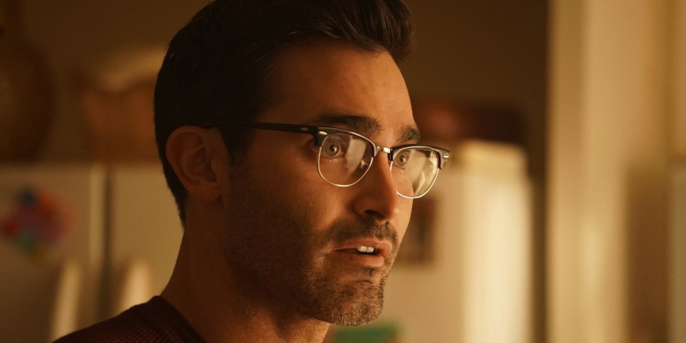 Tyler Hoechlin wearing glasses as Clark Kent talking in Superman and Lois.