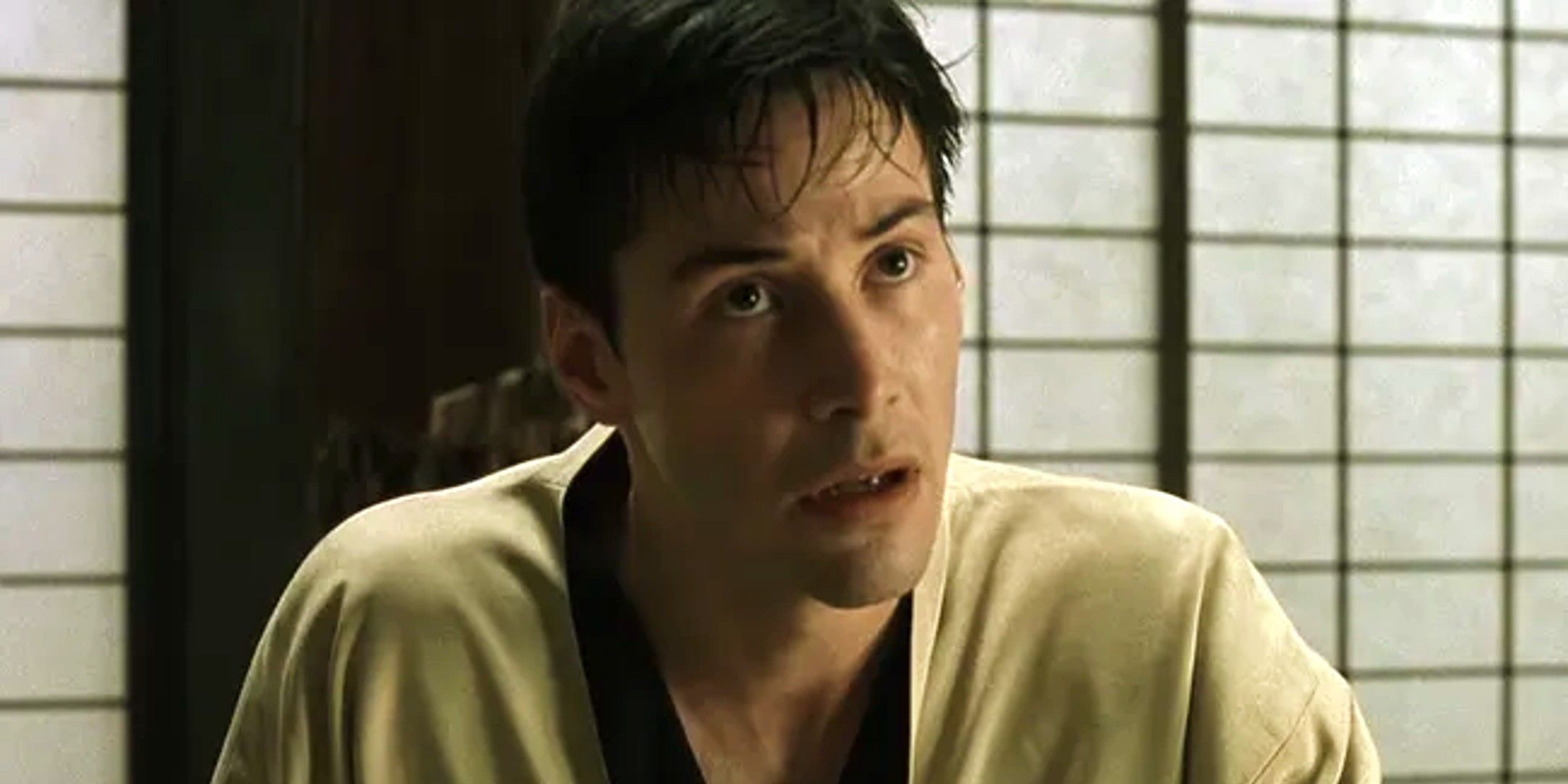 Keanu Reeves as a confused looking Neo in The Matrix