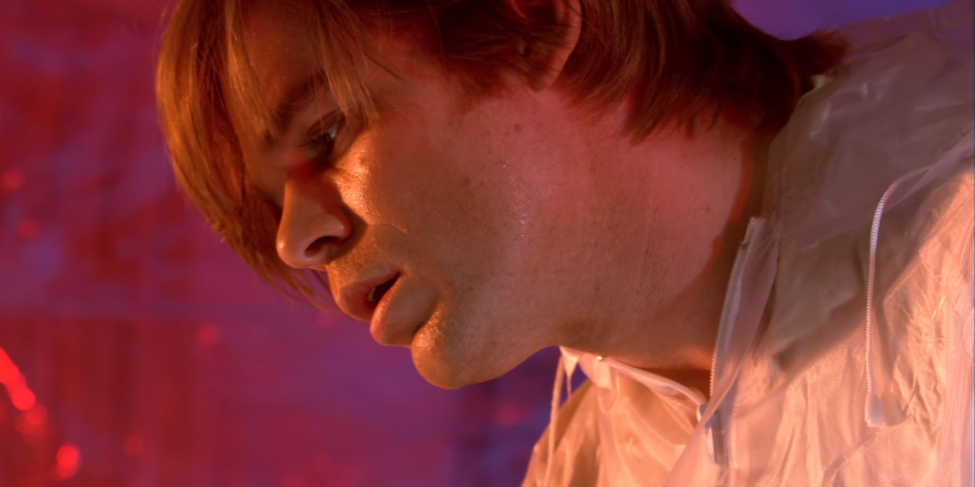Michael C Hall as Young Dexter looking down at something offscreen in Dexter