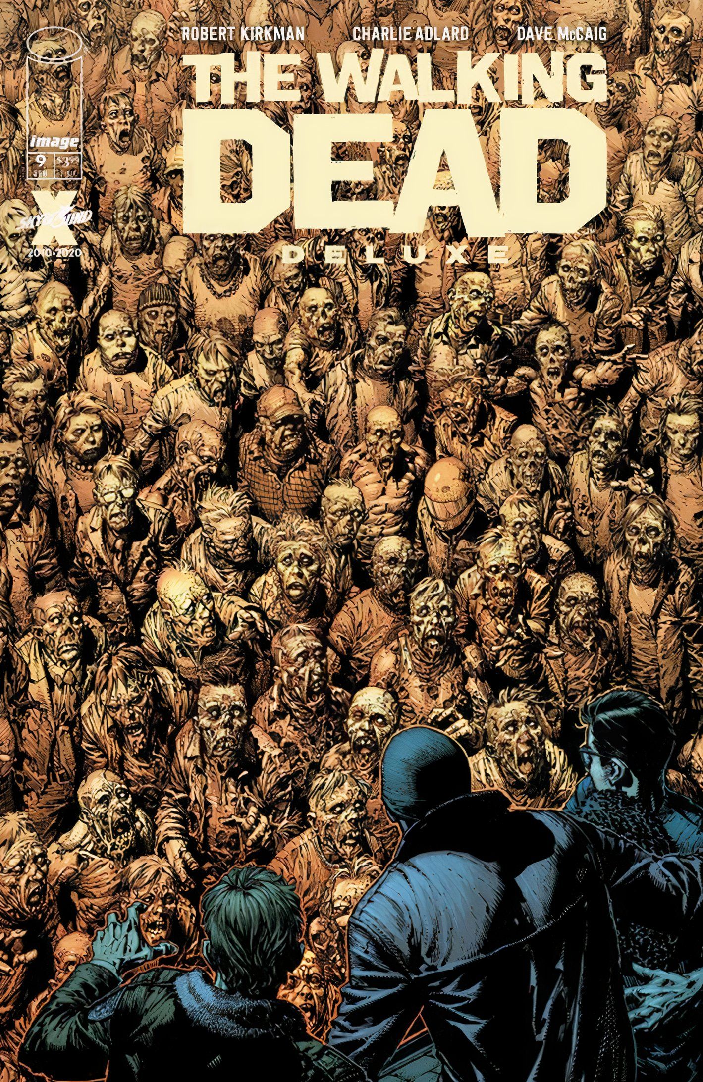 Walking Dead Deluxe #9 cover, featuring human protagonists confronted by a wall of zombies 