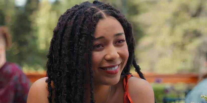 Hayley smiles at someone offscreen in My Life With the Walter Boys season 1