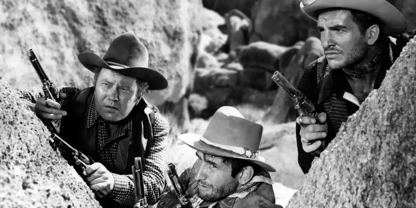 Three gunfighters hiding behind a rock in Tombstone: The Town Too Tough to Die