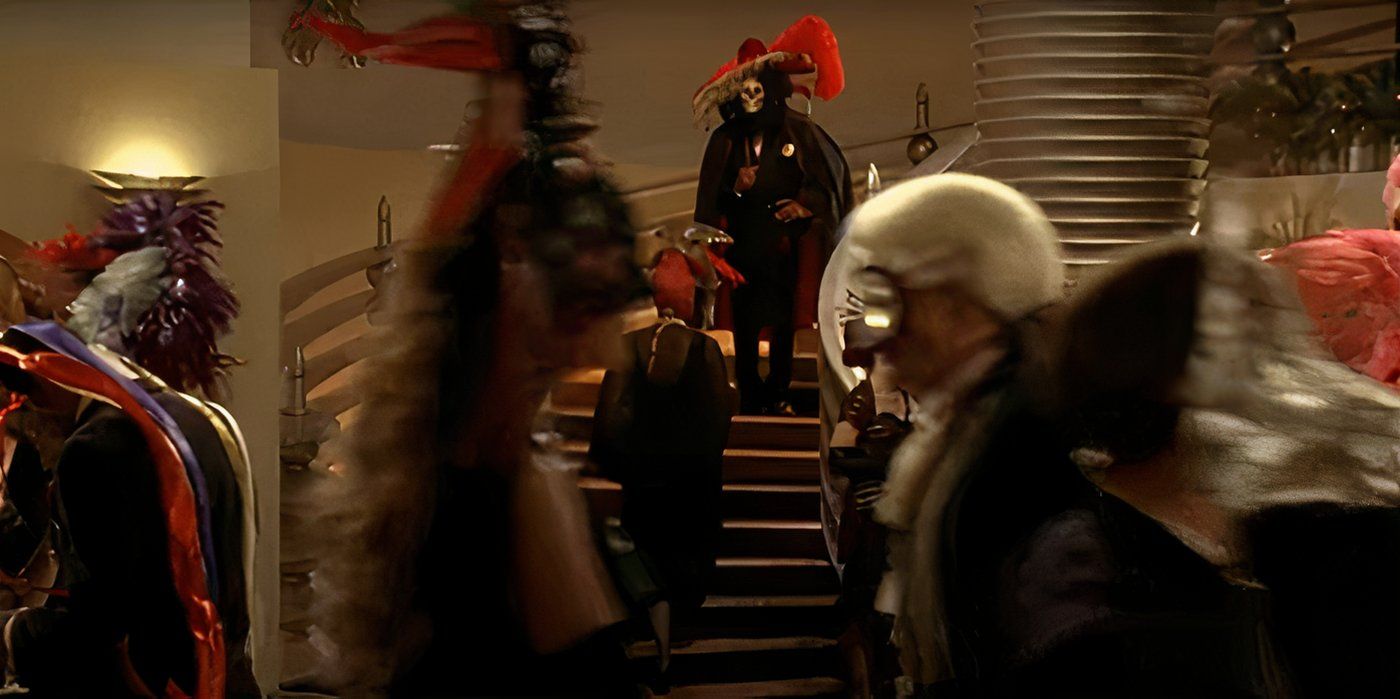 a guest dressed as the Masque of the Red Death at the masquerade ball in Batman Returns