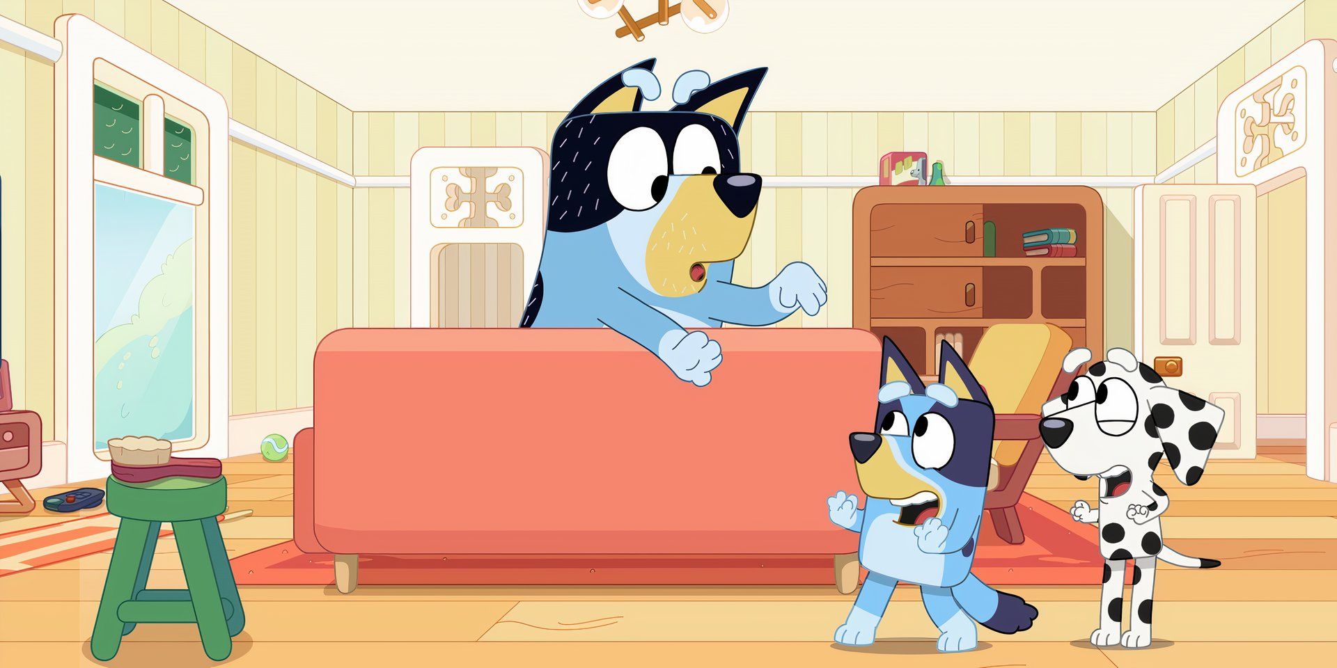 Bandit waves his arms while leaning over the couch while Chloe and Bluey laugh in the Octopus episode of Bluey