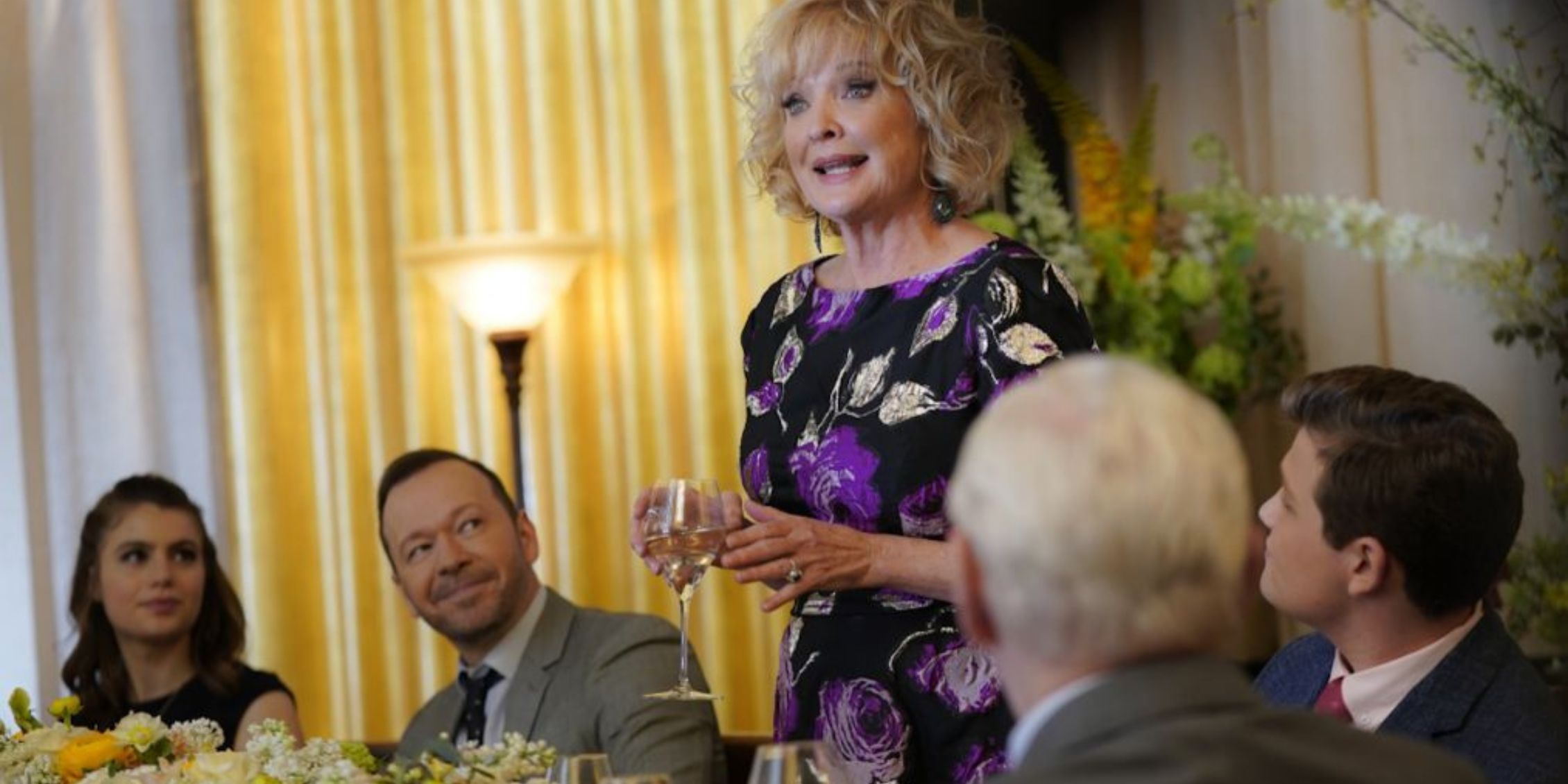 Blue Bloods Lena makes a toast while Danny, Nicky, Sean, and Henry look at her