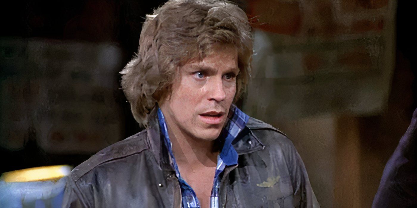 Bobby Wheeler (Jeff Conaway) parecendo confuso com a boca aberta no táxi