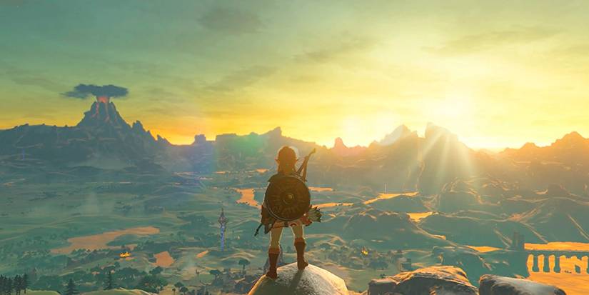 Link looking out over Hyrule's landscape in Breath of the Wild.