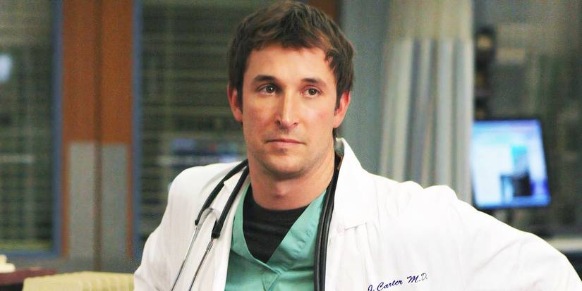 Carter leaning against a counter in ER