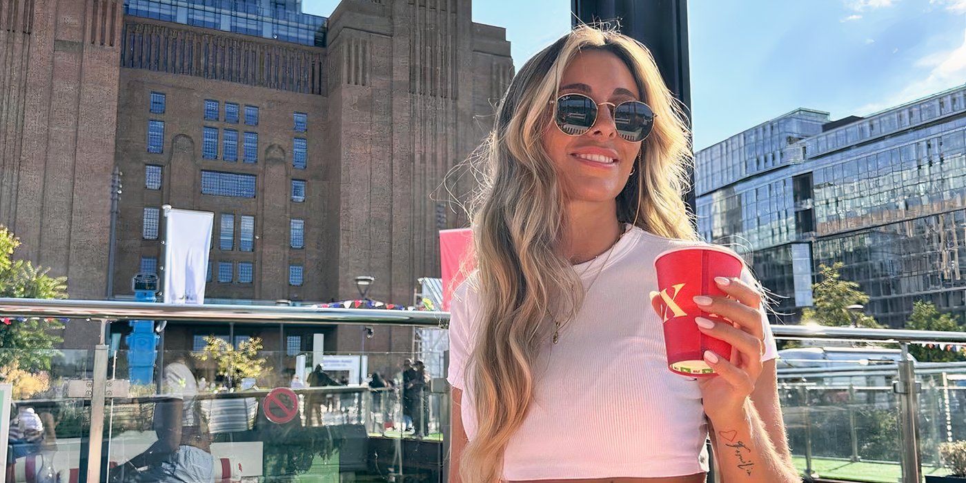 Love Is Blind UK Catherine holding a drink in a red cup on a rooftop