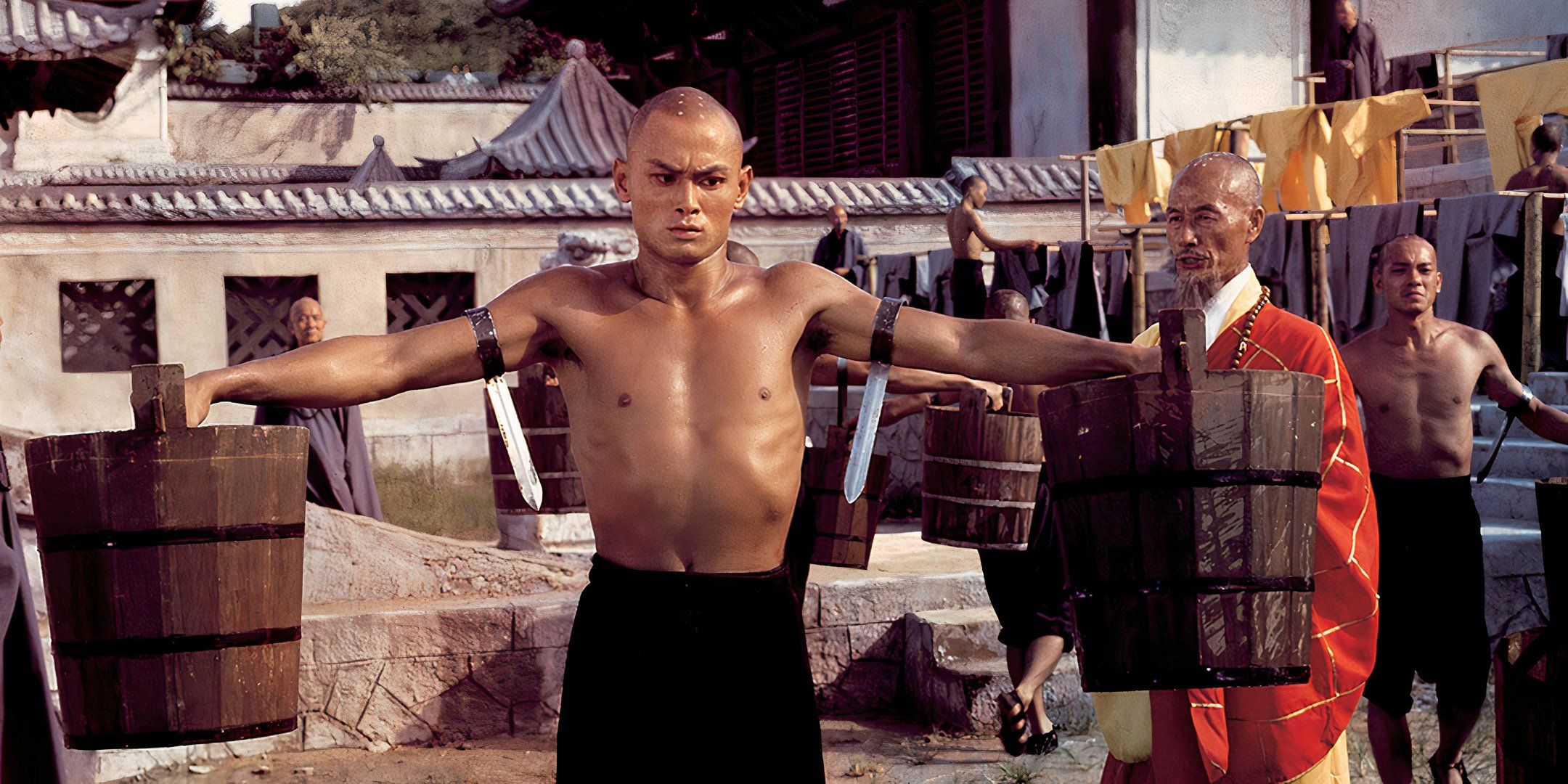 san te (gordon liu) trains with buckets in the 36th chamber of shaolin.