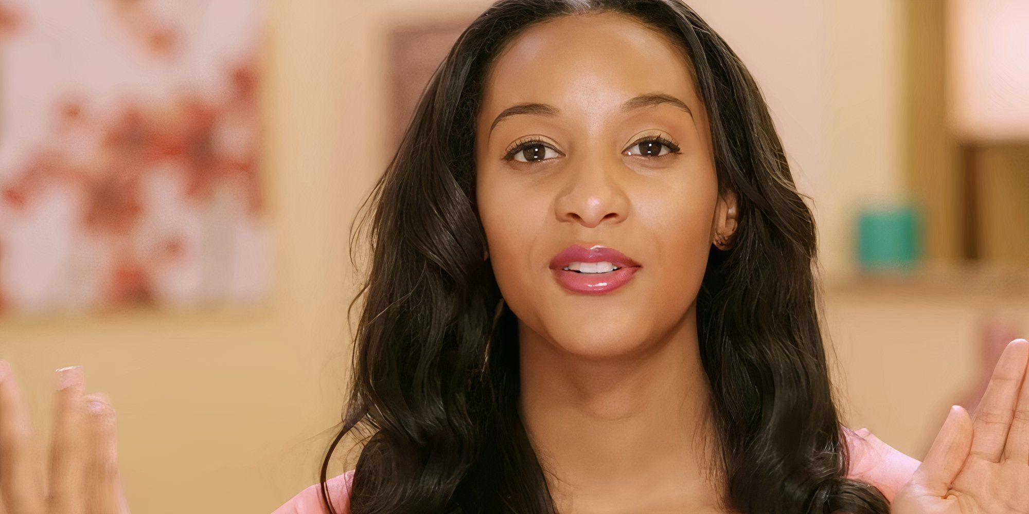 Chantel Everett in 90 Day Fiance during confessional wearing pink shirt and matching lip gloss