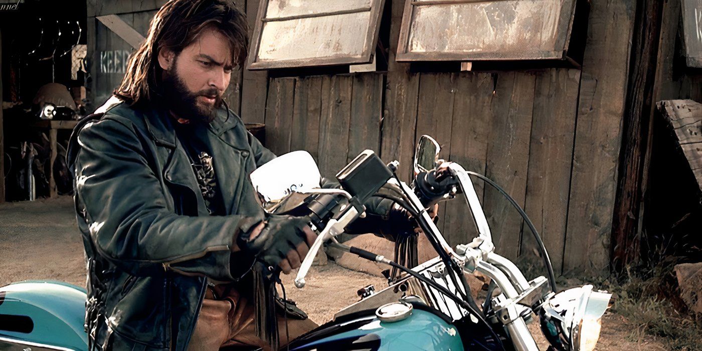 Charlie Sheen sitting on a motorcycle and looking at its handles in Beyond the Law(1)