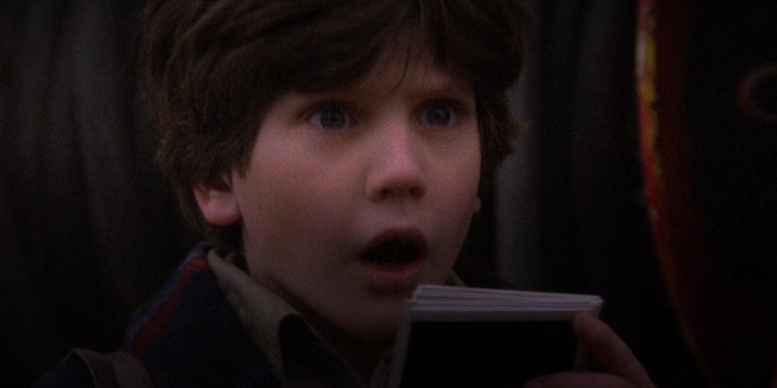 Kevin Looking Surprised Holding Pictures In Time Bandits 1981 Movie.jpg