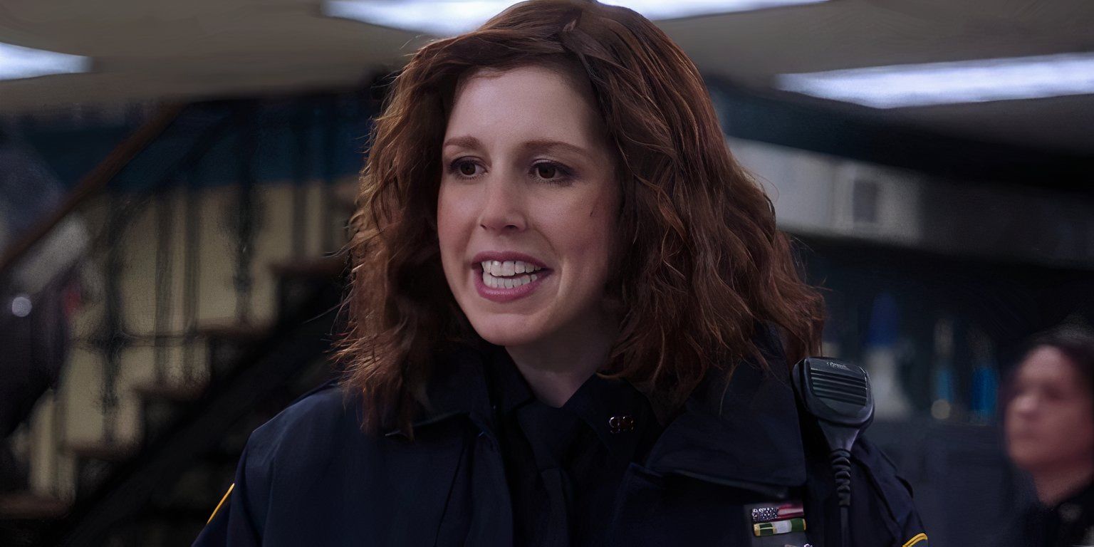 Debbie Fogle wears her police uniform and smiles in Brooklyn Nine-Nine.