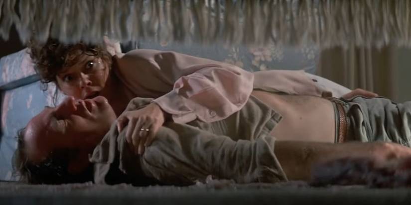 Diane Freeling (JoBeth Williams) holding Steve Freeling (Craig T. Nelson) while watching a worm crawl away in Poltergeist II The Other Side.
