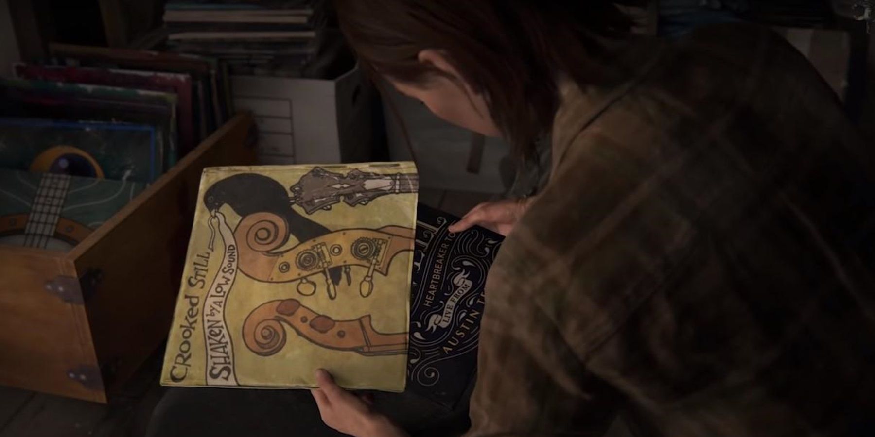 Ellie browses through her notes in The Last of Us Part II