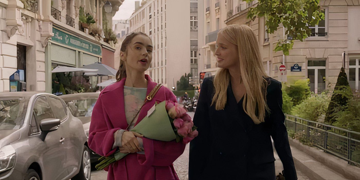 Emily (Lily Collins) carrying flowers and walking outside with Camille (Camille Razat) in Emily In Paris