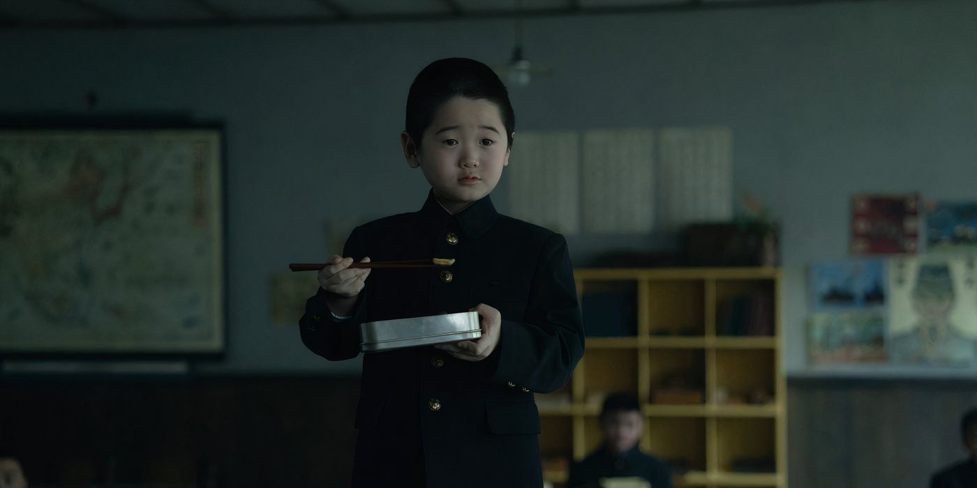 Eunseong Kwon stands on his desk while eating in Pachinko Season 2