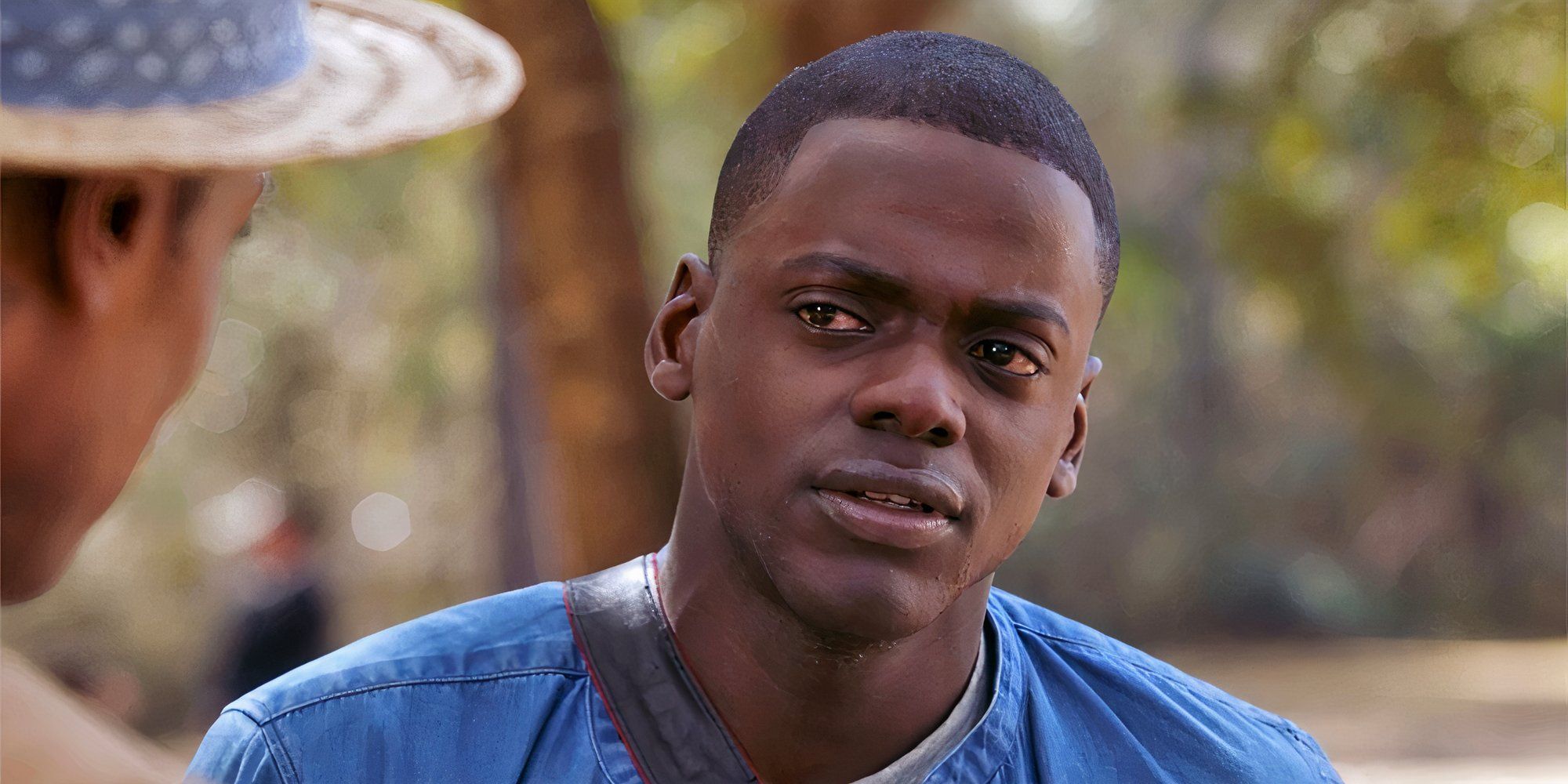 Daniel Kaluuya looks at character with confused expression.