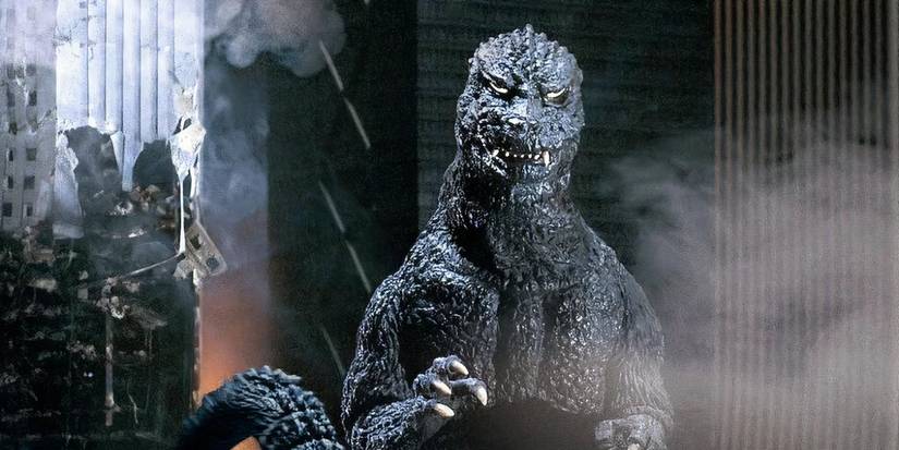 Godzilla standing in front of destroyed buildings in The Return of Godzilla.